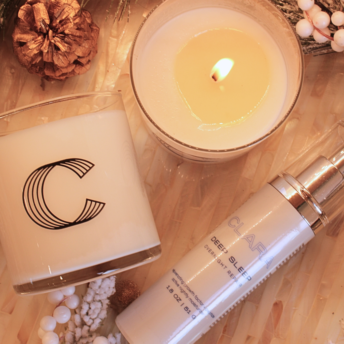 CLARA Dermatology Black Friday bundle: overnight repair moisturizer and candle
